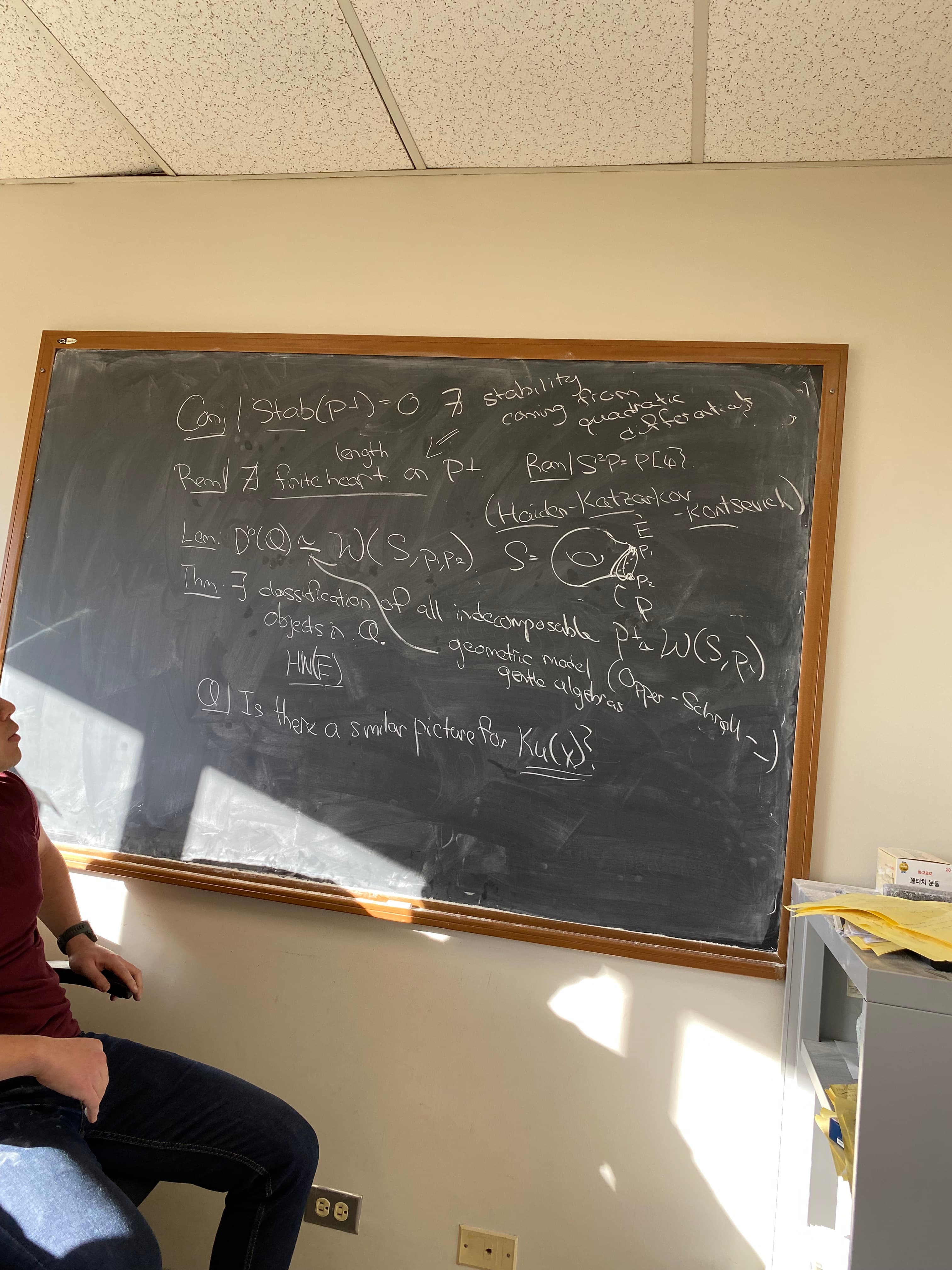 Chris working at a blackboard
